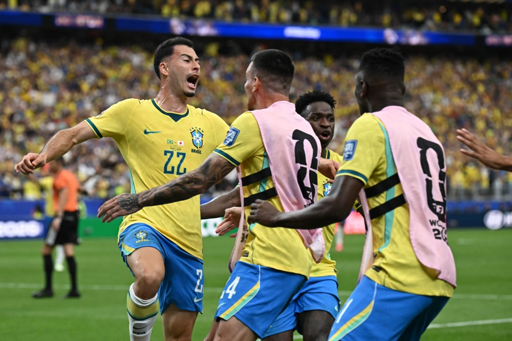 Brazil's #22 Martinelli (L) celebrates with teammates. — AFP 