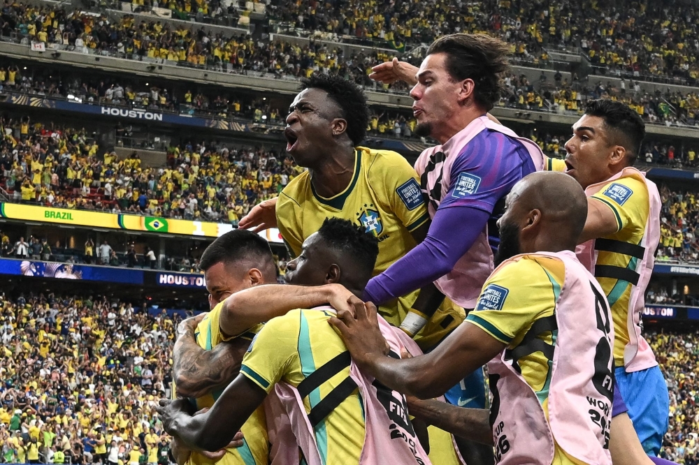Brazil's players celebrate their second goal. — AFP 