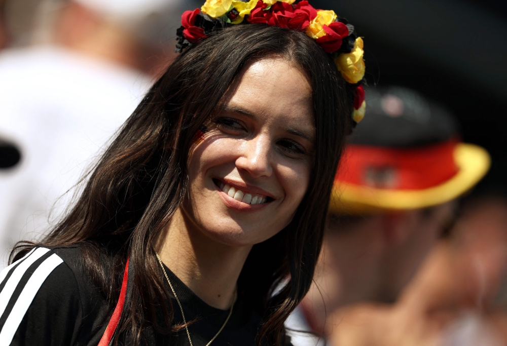 A German fan smiles ahead of the 2026 World Cup round of 32 football match between Germany and Paraguay at the Boston Stadium in Foxborough  