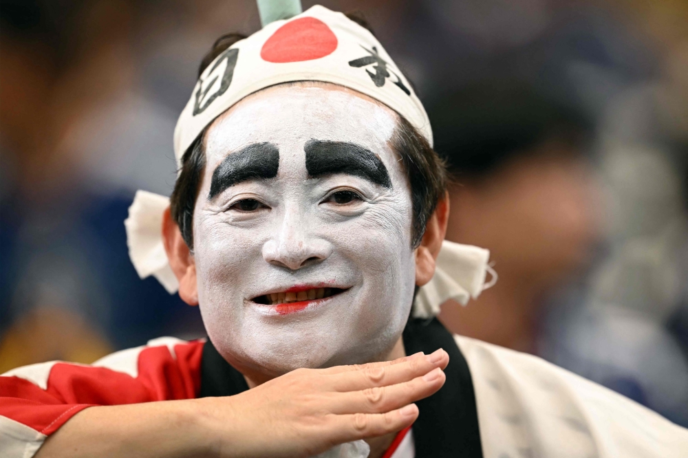A Japan's supporter poses ahead of the 2026 World Cup round of 32 football match between Brazil and Japan at the Houston Stadium  