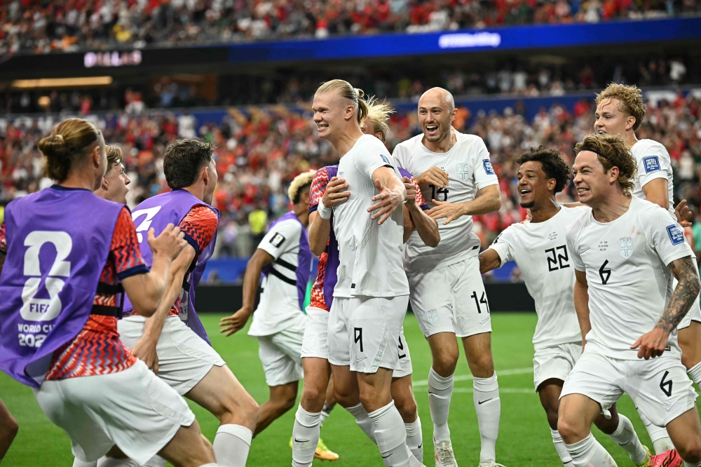 Norway's #09 Haaland (C) celebrates with teammates after second goal. — AFp
