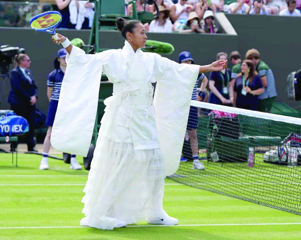 Osaka walked on to the court in a dress embroidered with cranes and cherry blossoms, created alongside designer Hana Yagi. — AFP