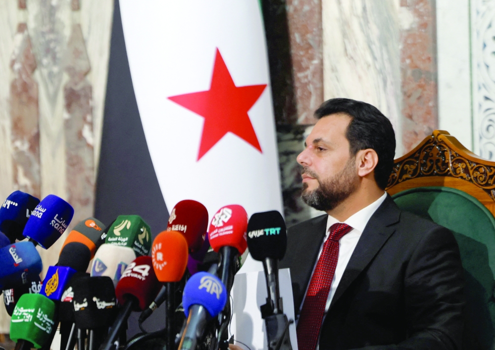 Mohammed Taha al Ahmad, chairman of Syria's Higher Committee for People's Assembly Elections, reacts as they announce the names of 70 lawmakers, in Damascus. — Reuters