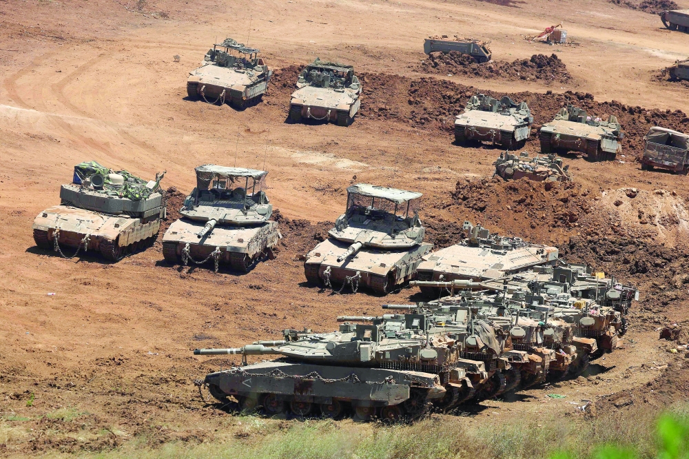 Israeli army tanks positioned along the Israel-Lebanon border. — AFP