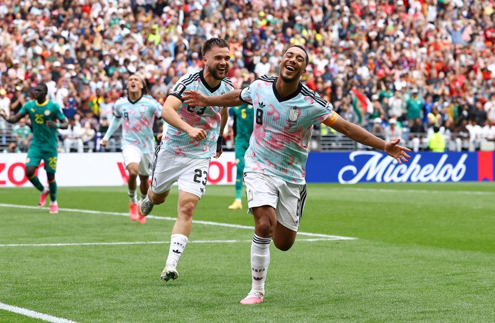  
Belgium's Tielemans celebrates third goal with Raskin. — Reuters 