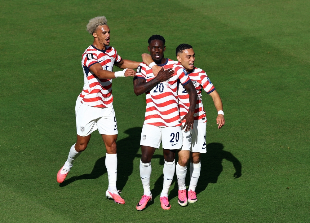 Balogun celebrates with Dest and Robinson after disallowed goal. — Reuters  