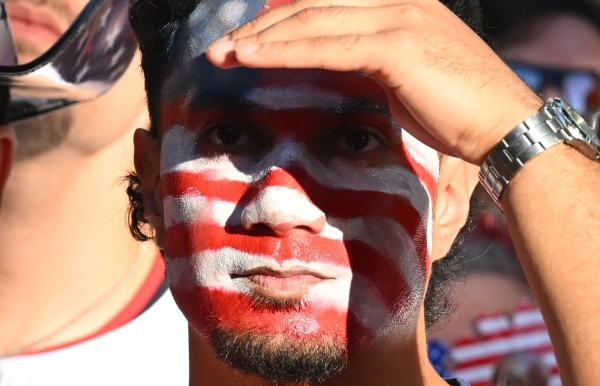 Fans paint stand with passion