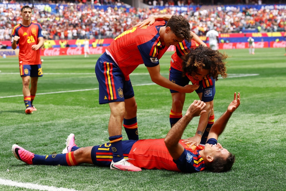  
Spain's Oyarzabal celebrates third goal with Gavi and Cucurella. — Reuters 