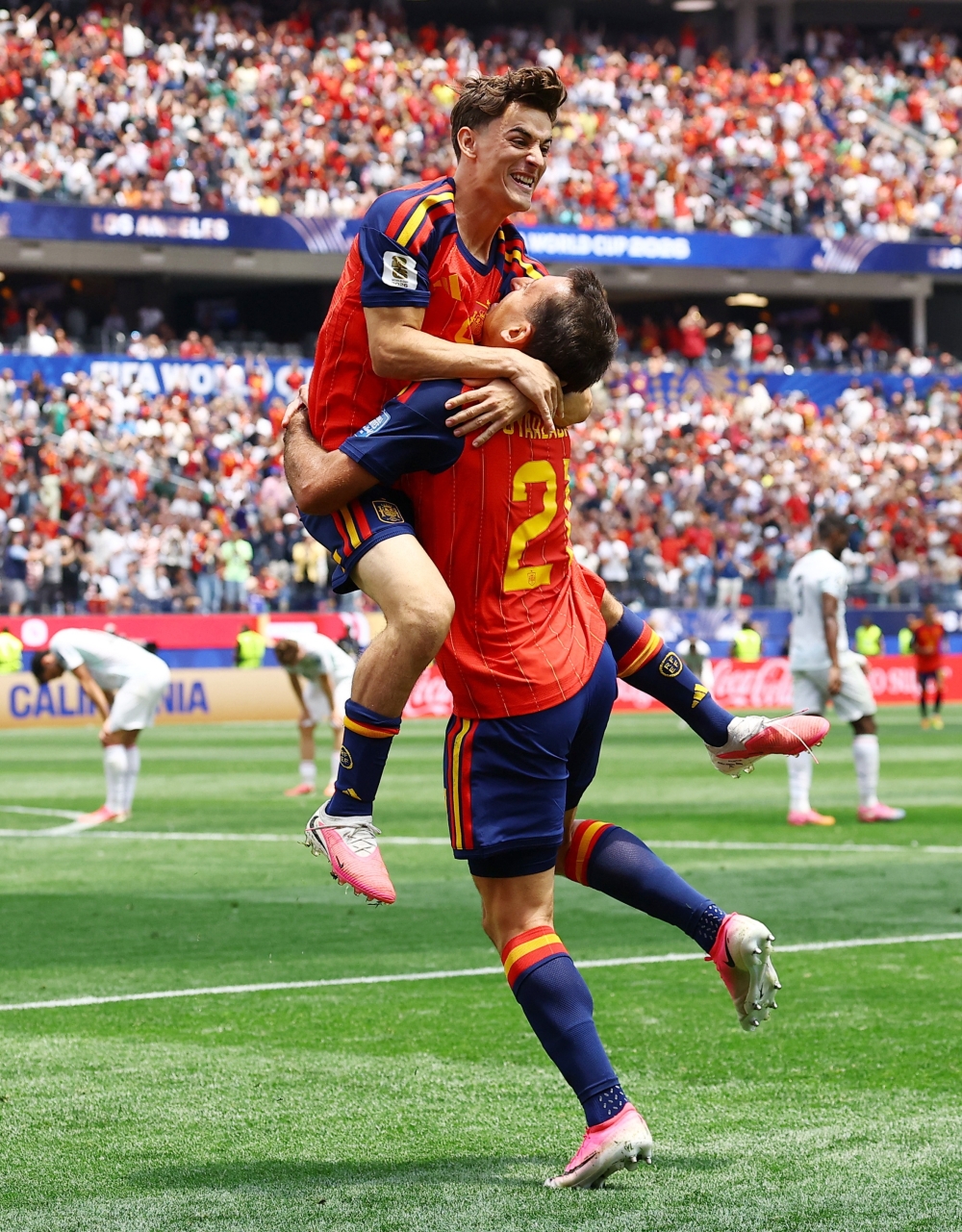  
Spain's Oyarzabal celebrates third goal with Gavi. — Reuters  