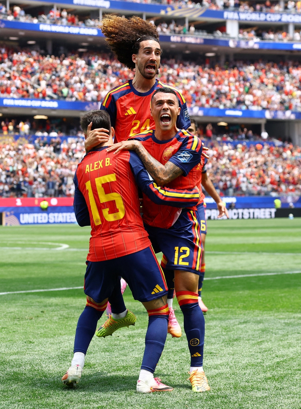  
Spain's Pedro celebrates second goal with Baena and Cucurella. — Reuters