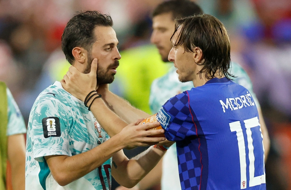 Croatia's #10 Modric and Portugal's #10 Silva at the end. — Reuters 