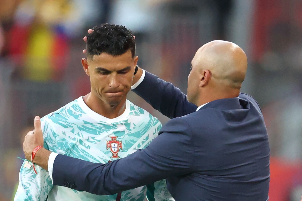 Portugal's #07 Ronaldo and Spanish head coach Martinez. — Reuters  