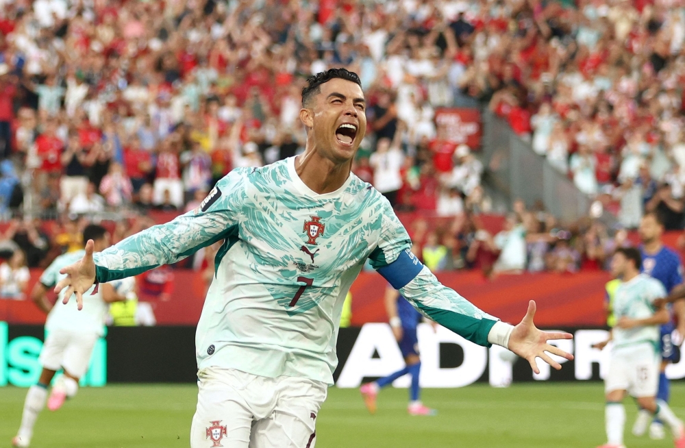 Portugal's #07 Ronaldo celebrates after first goal. — AFP