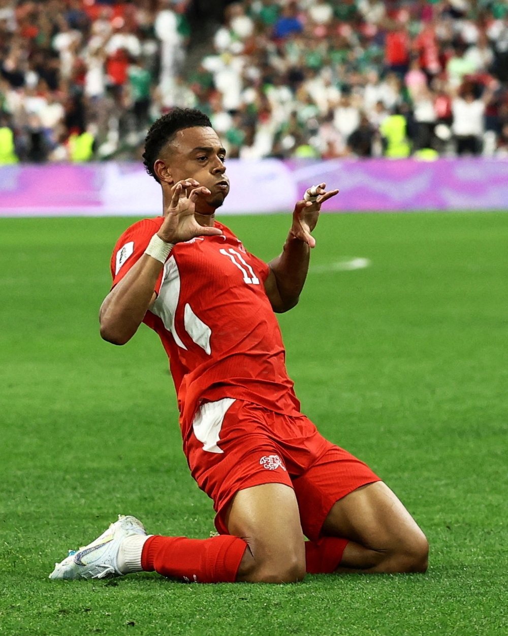  
Switzerland's Ndoye celebrates second goal. — Reuters 
