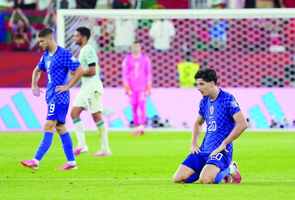 Croatia's Igor Matanovic and Andrej Kramaric look dejected after the match as Croatia are eliminated from the World Cup. — Reuters