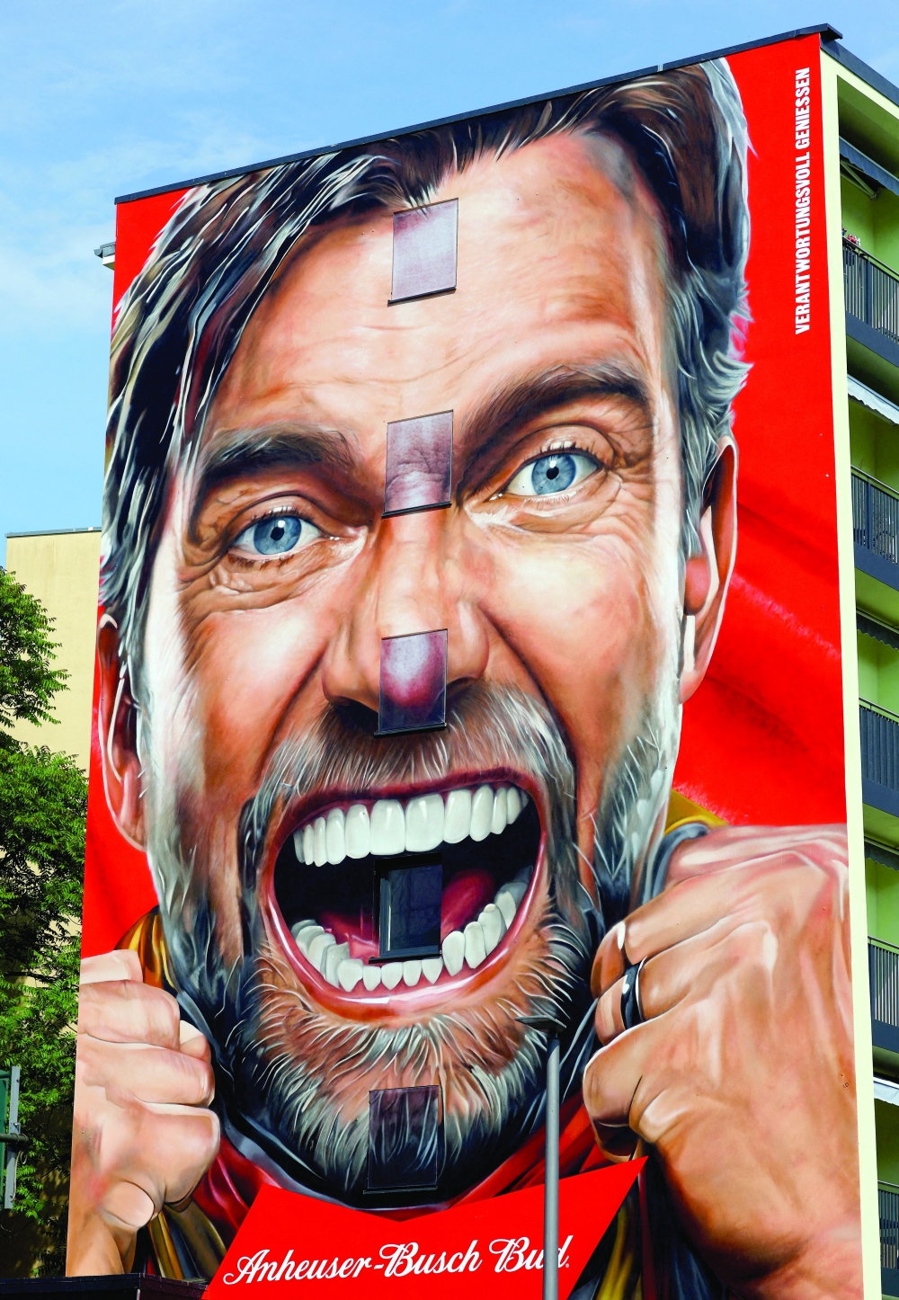 An advertising mural depicting Juergen Klopp, Head of Global Soccer for Red Bull, on a building during Fifa World Cup in Berlin. — Reuters 