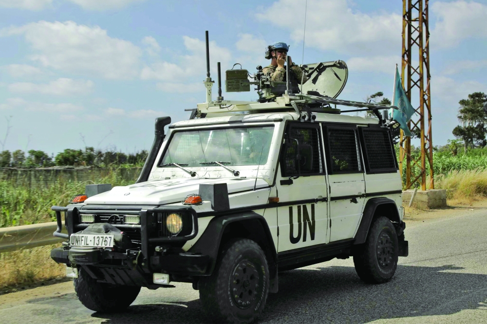 Members of the United Nations Peacekeeping Force in Lebanon (UNIFIL) drive through the southern Lebanese area of Al Mansouri. - AFP 