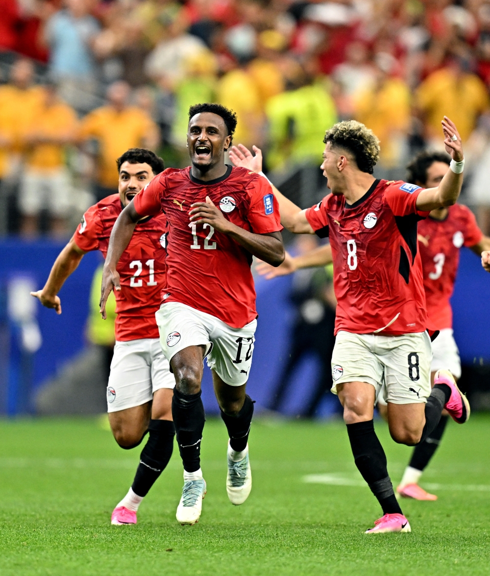  
Egypt's Hassan and Ashour celebrate after the match. — Reuters 