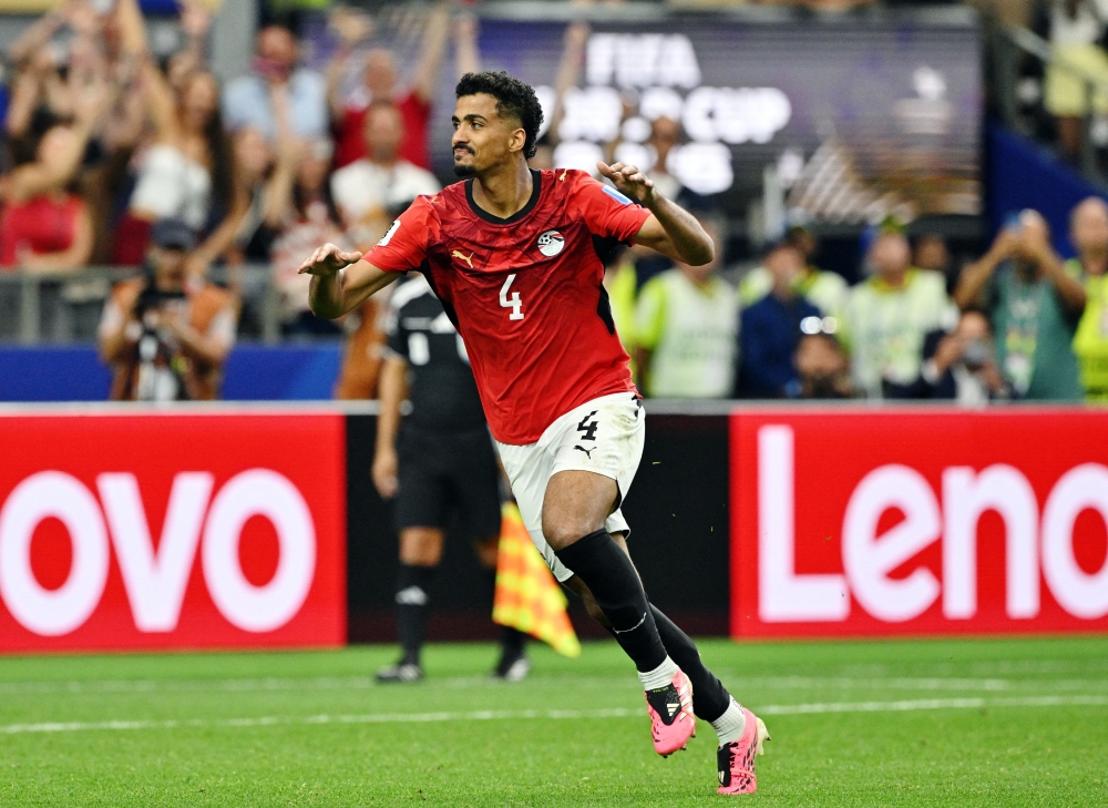  
Egypt's Abdelmaguid celebrates scoring a penalty. — Reuters  