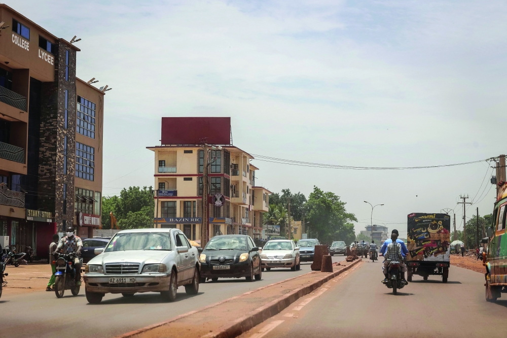 A general view shows traffic moving along a main road in Bamako. — AFP