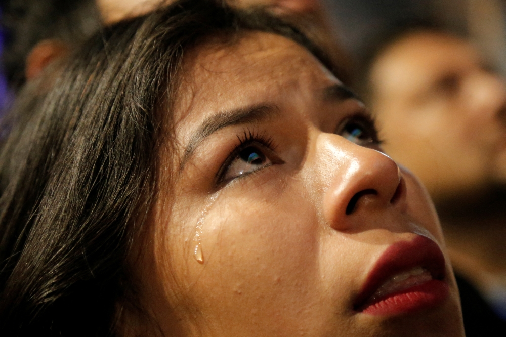 Paraguay fans look dejected after the match as Paraguay are eliminated from the World Cup as fans gather in Asuncion