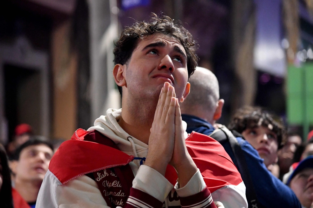 A Paraguay supporter reacts as he watches the FIFA World Cup 2026 round-of-32 football match between Paraguay and France in Asuncion on July 4, 2026.