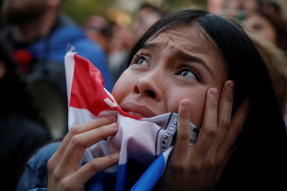A Paraguay fan as fans gather in Asuncion during the match 