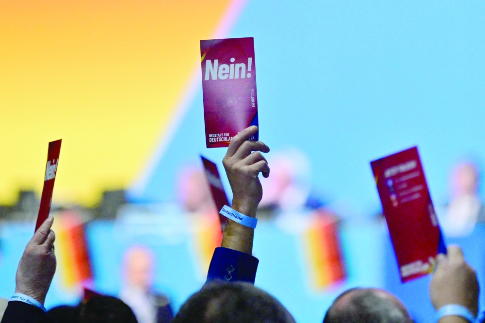 Delegates hold up 'No' voting cards on the second day of the party congress of far-right Alternative for Germany (AfD) at the Messe Erfurt fairground in Erfurt. — AFP