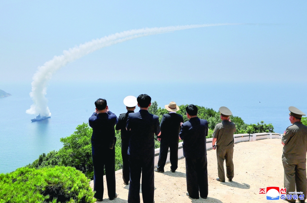 North Korean leader Kim Jong Un observes an assessment of the newly built naval destroyer Kang Kon's combat systems. — Reuters