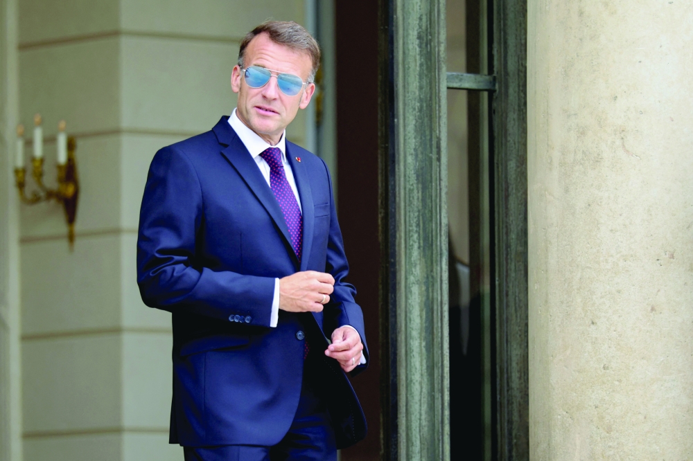 France's President Emmanuel Macron poses at the Elysee Presidential Palace in Paris. — AFP