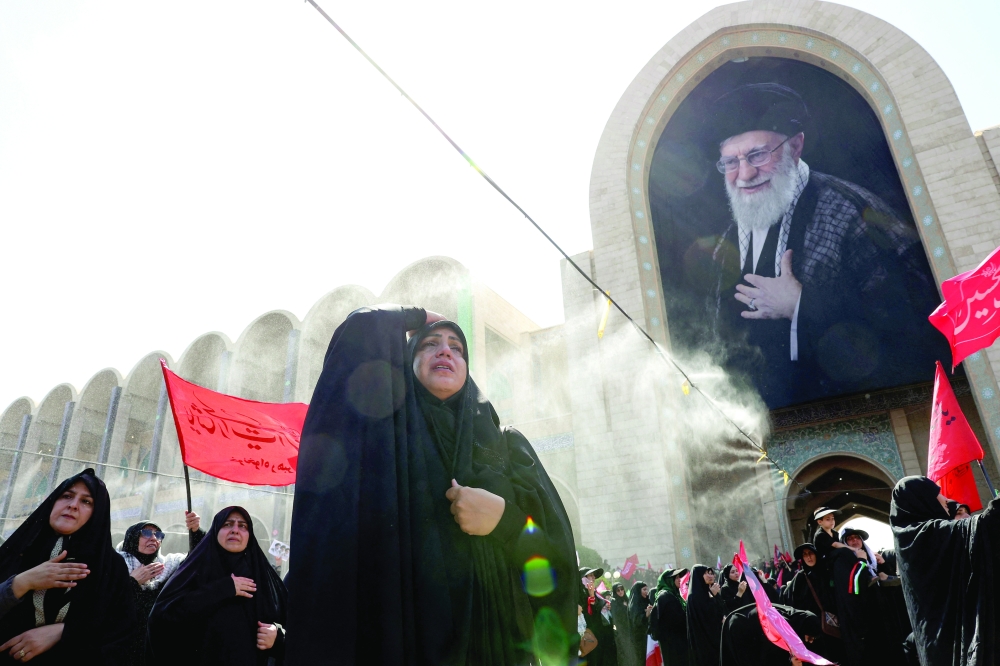 Mourners grieve as they gather to pray for Iran's slain supreme leader Ayatollah Ali Khamenei during the second day of funeral ceremonies at the Grand Mosalla in Tehran. - AFP