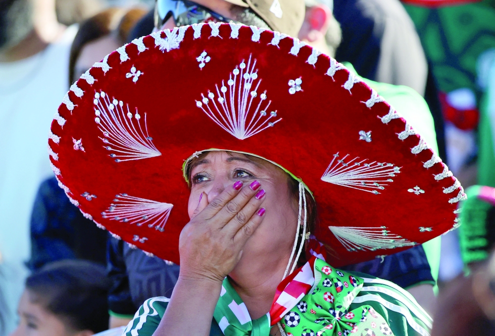 Mexico fans looks dejected at a fan zone after England's Jude Bellingham scores their second goal. — Reuters