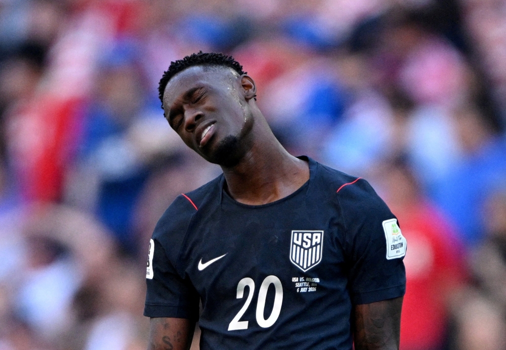  
Folarin Balogun of the U.S. looks dejected after Belgium's Hans Vanaken scores their third goal  