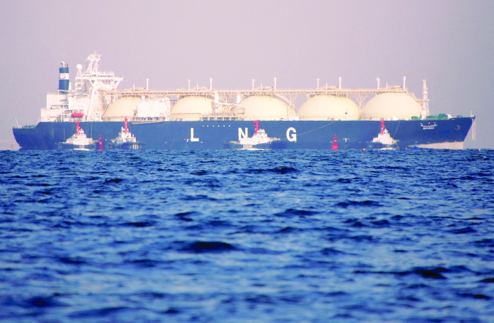 A liquefied natural gas (LNG) tanker is tugged towards a thermal power station in Futtsu, east of Tokyo, Japan. — Reuters