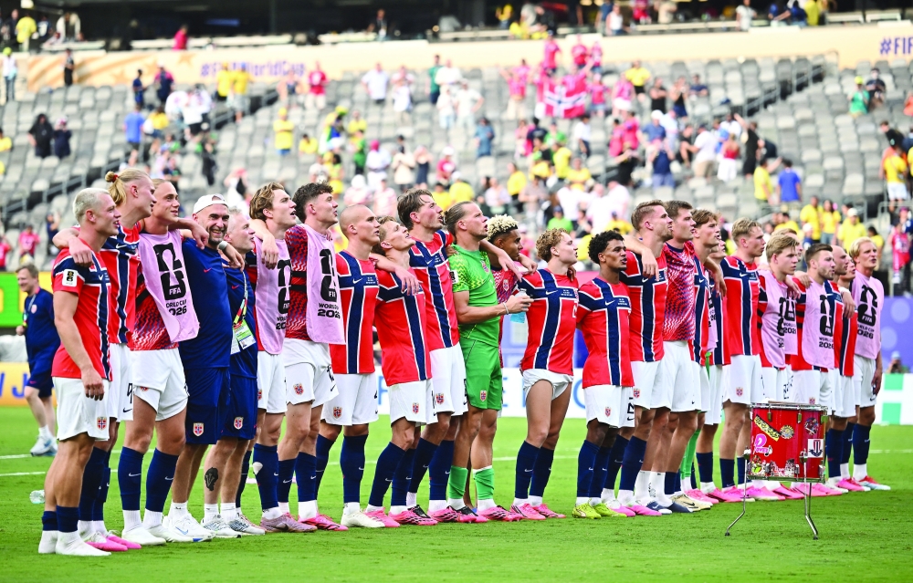 Norway players celebrate after the match as Norway qualify for the quarter finals of the World Cup. — REUTERS