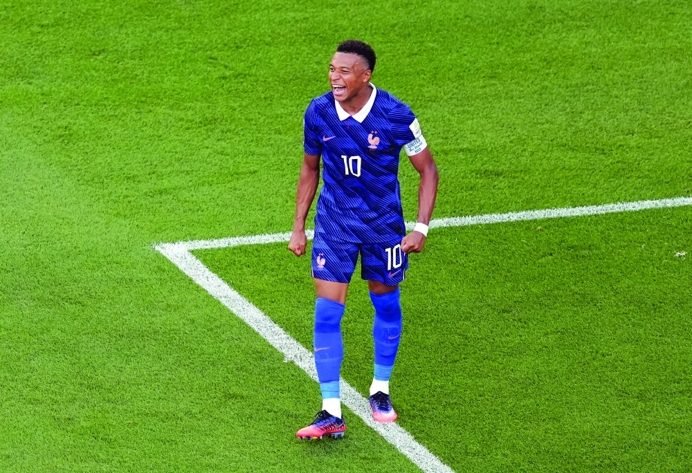 France's Kylian Mbappe celebrates after the match. — Reuters