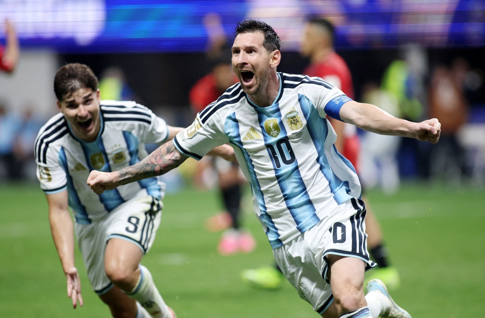  
Argentina's Lionel Messi celebrates scoring their second goal with Julian Alvarez 