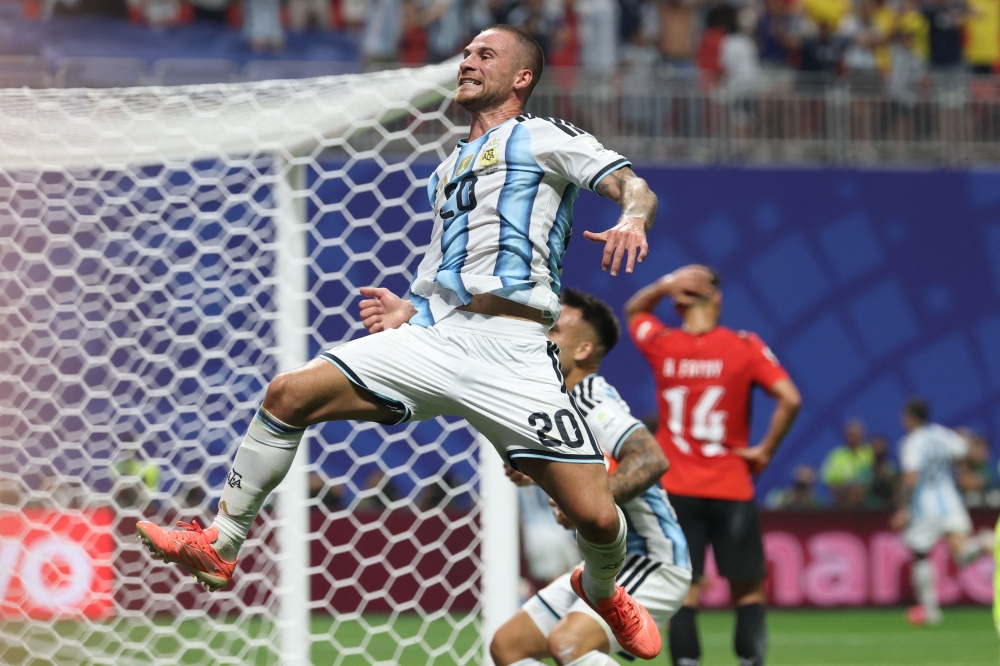 TOPSHOT - Argentina's midfielder #20 Alexis Mac Allister reacts after Argentina's second goal  
