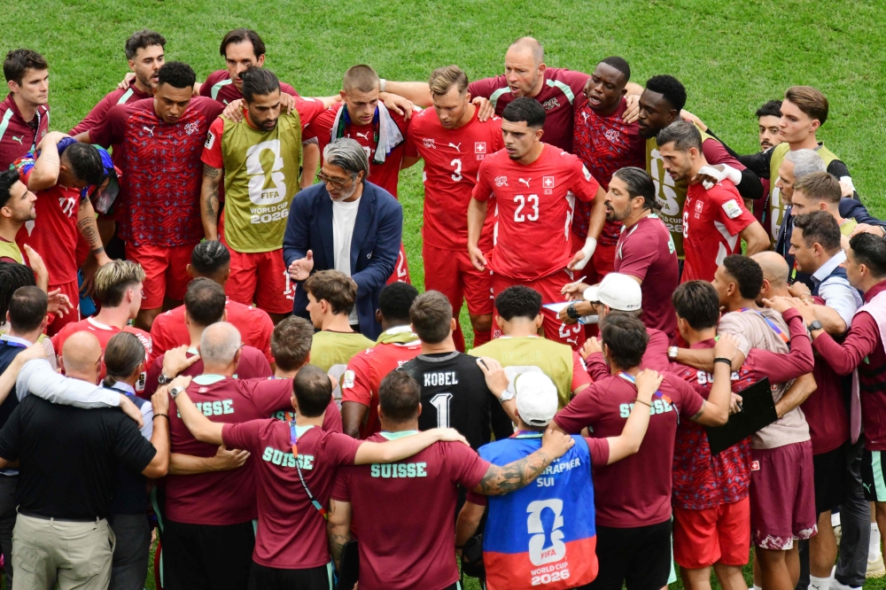 Switzerland's head coach Murat Yakin speaks to his players. — Reuters 