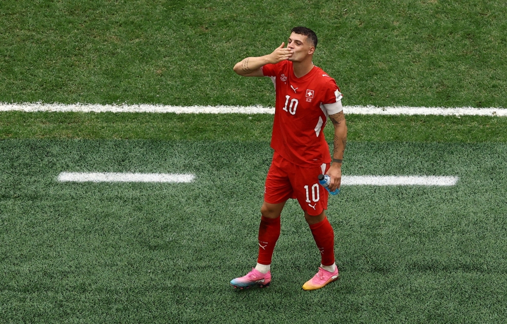  
Switzerland's Granit Xhaka celebrates after the match. — Reuters  