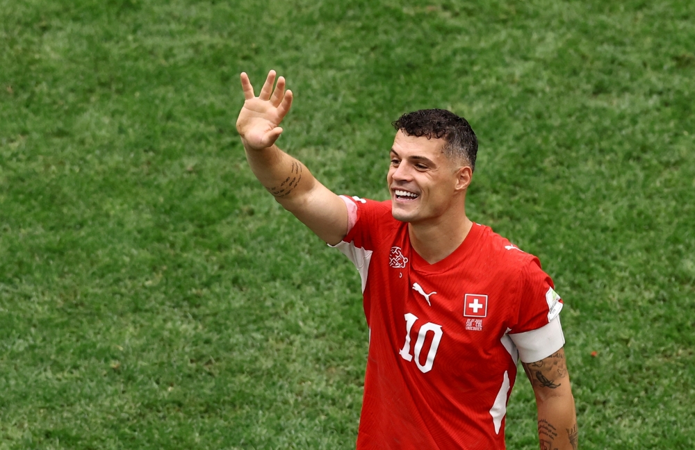  
Switzerland's Granit Xhaka celebrates after the match. — Reuters   