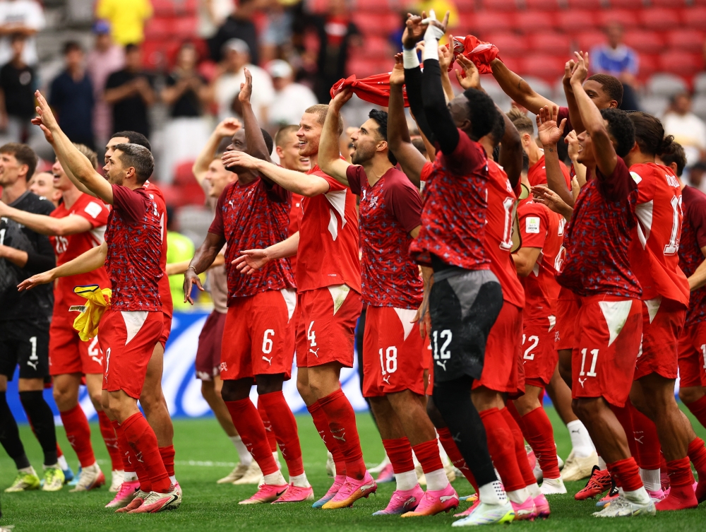  
Switzerland players celebrate after the match. — Reuters 