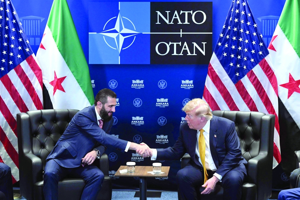 US President Donald Trump meets Syrian President Ahmed al Sharaa (L) at the Bestepe Presidential Compound in Ankara. — AFP