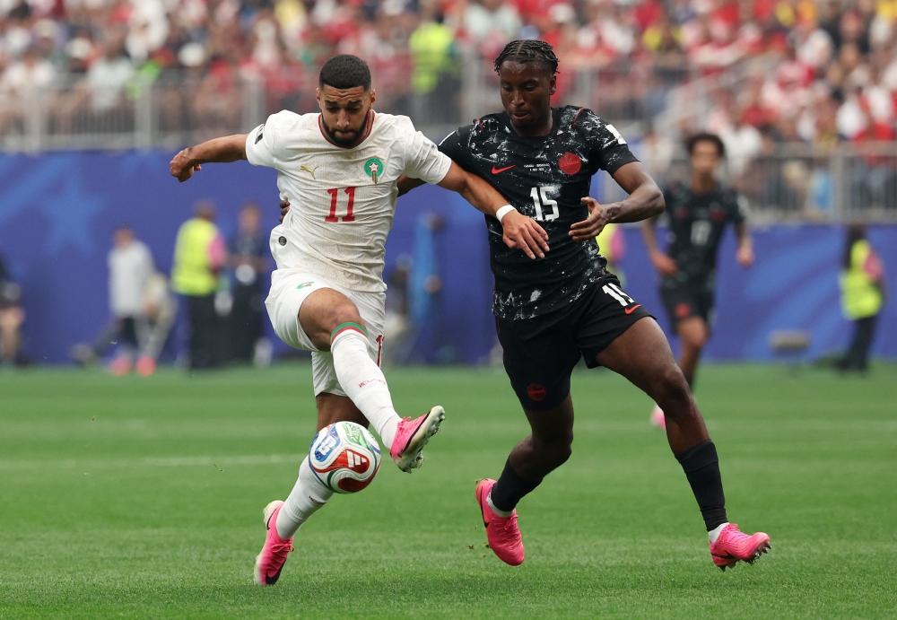  
Morocco's Ismael Saibari in action with Canada's Moise Bombito 