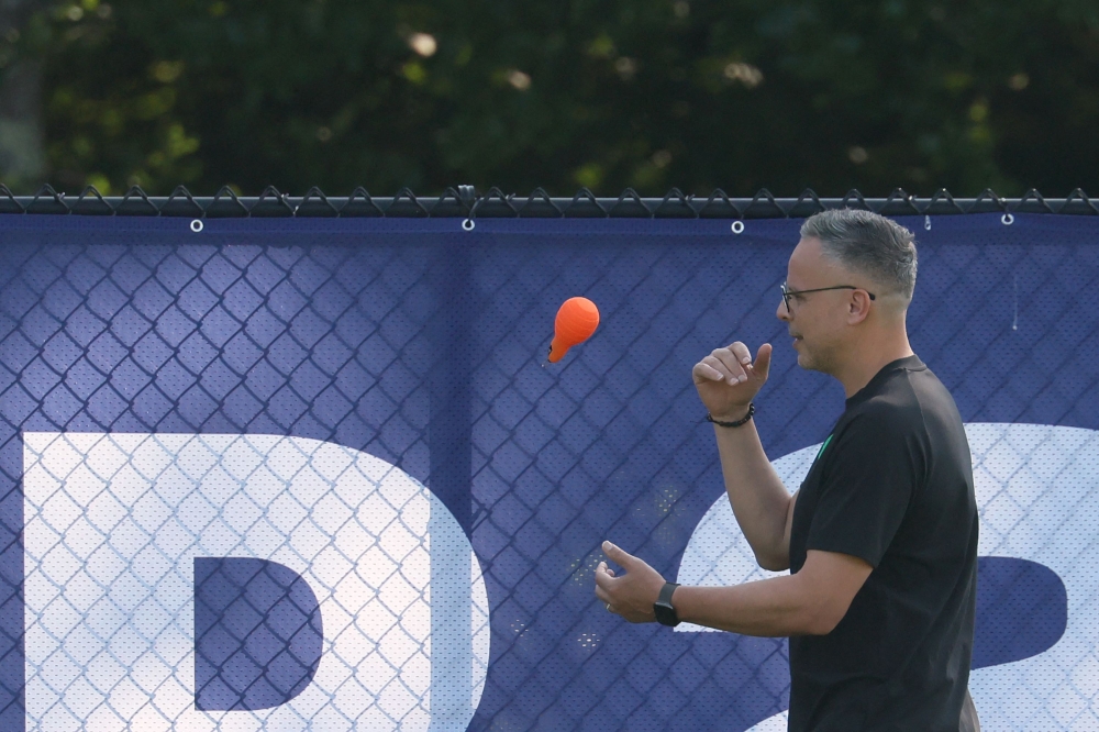 Morocco's head coach Mohamed Ouahbi takes part in an MD-1 training session   