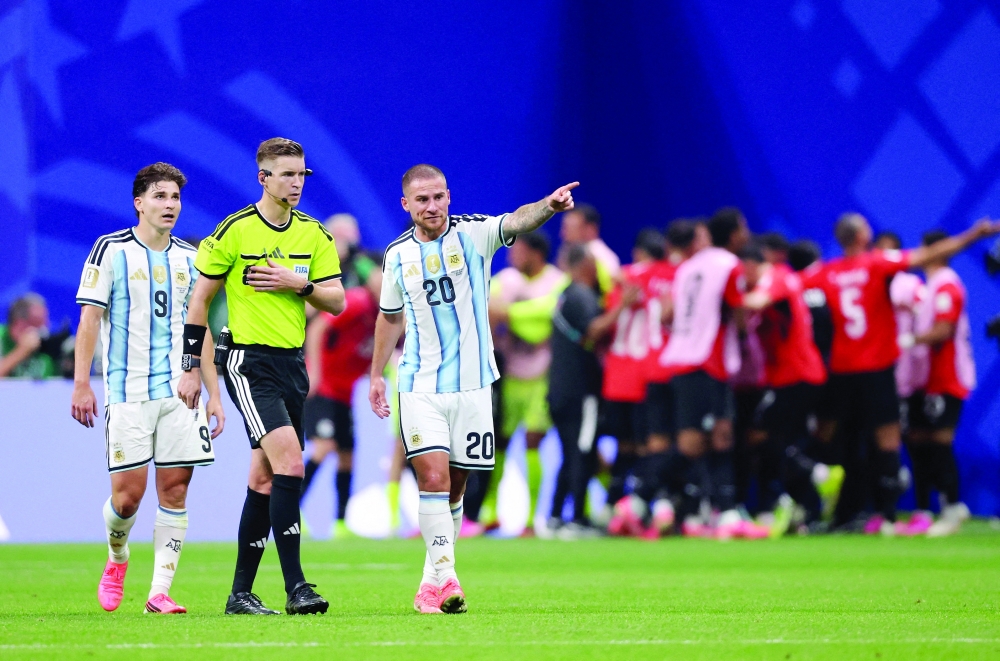 Argentina's Julian Alvarez and Alexis Mac Allister remonstrate to referee Francois Letexier before he disallowed Egypt's Mostafa Zico's goal. — Reuters
