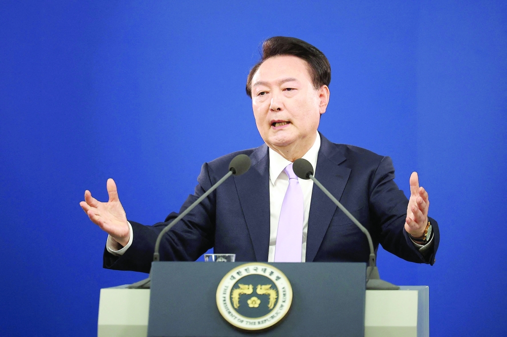 South Korean President Yoon Suk Yeol answers a reporter's question during a press conference at the Presidential Office in Seoul on November 7, 2024. South Korea's highest court on July 9, 2026 upheld ex-president Yoon Suk Yeol's seven year prison sentence over crimes tied to his botched 2024 martial law declaration and its chaotic aftermath.

