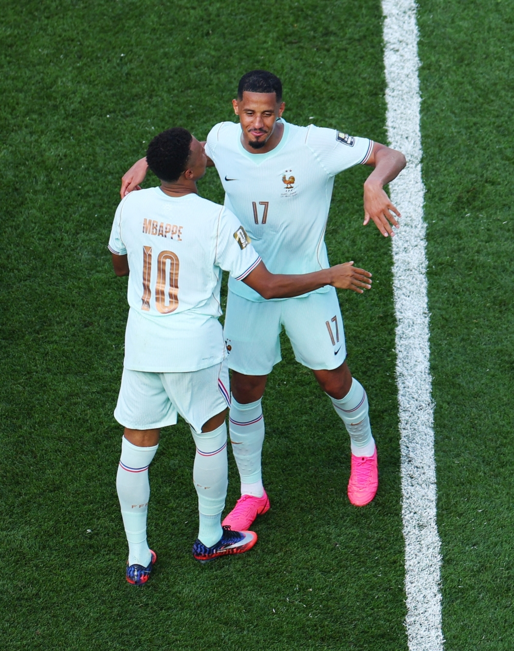  
France's Kylian Mbappe and William Saliba celebrate after the match  