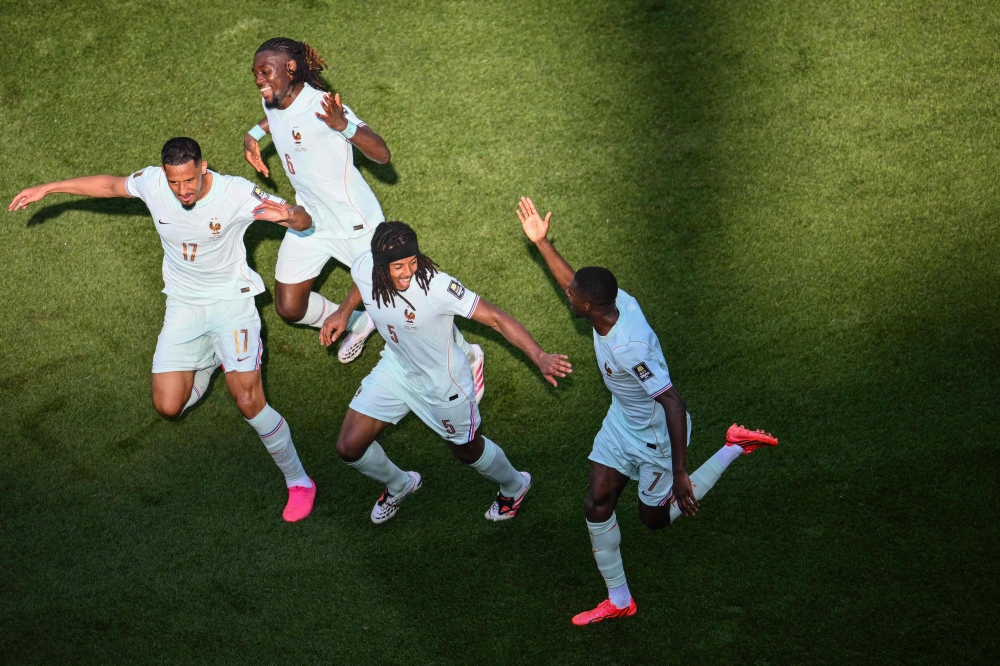 France's forward #07 Ousmane Dembele celebrates with teammates France's defender #17 William Saliba, France's midfielder #06 Manu Kone and France's defender #05 Jules Kounde after scoring his team's second goal  