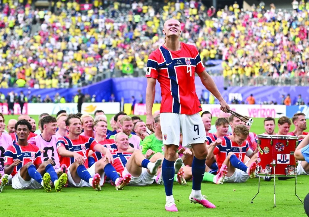 Norway's Erling Haaland with teammates celebrate after the match as Norway qualify for the quarter finals of the World Cup. — Reuters